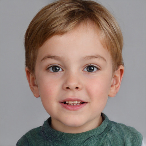 Joyful white child male with short  brown hair and blue eyes