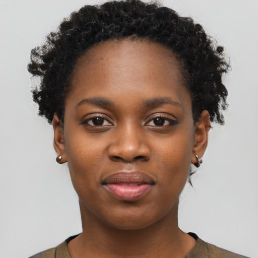 Joyful black young-adult female with short  black hair and brown eyes