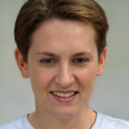 Joyful white young-adult female with short  brown hair and grey eyes