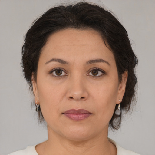 Joyful white adult female with medium  brown hair and brown eyes