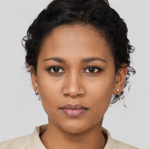 Neutral latino young-adult female with short  black hair and brown eyes