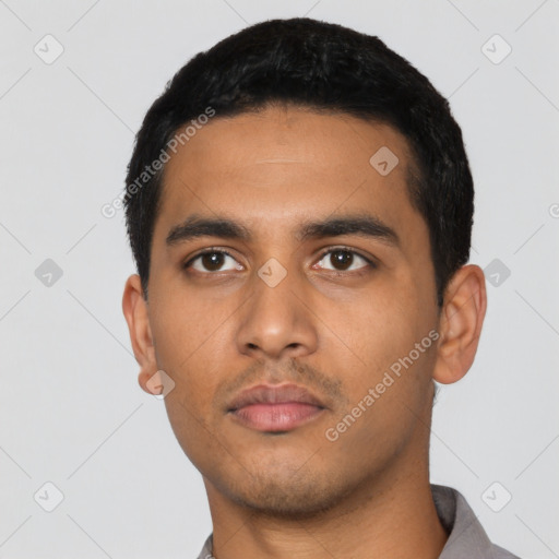Neutral latino young-adult male with short  black hair and brown eyes