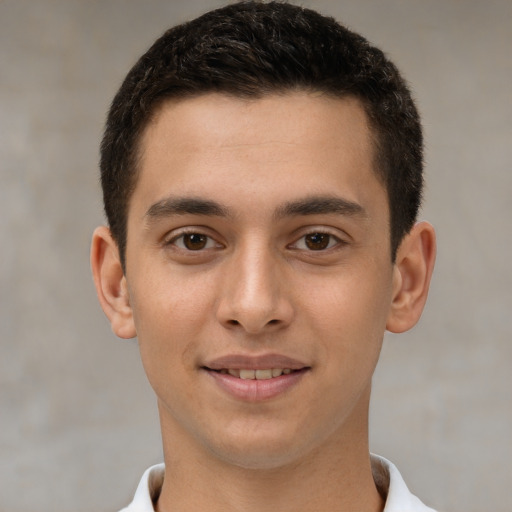 Joyful white young-adult male with short  brown hair and brown eyes