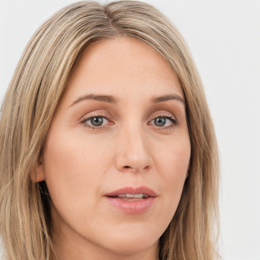 Joyful white young-adult female with long  brown hair and green eyes