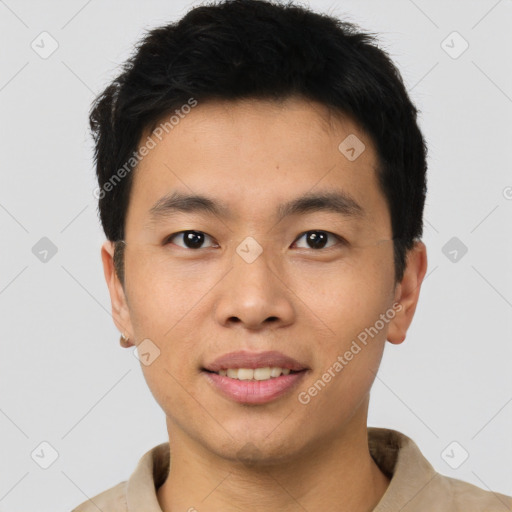 Joyful asian young-adult male with short  black hair and brown eyes