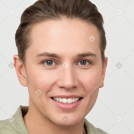 Joyful white young-adult female with short  brown hair and grey eyes