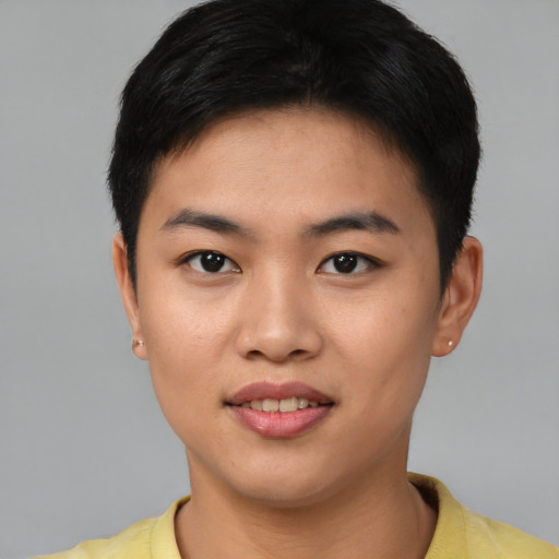 Joyful asian young-adult female with short  black hair and brown eyes
