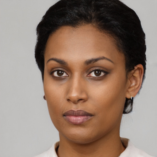 Neutral latino young-adult female with short  black hair and brown eyes