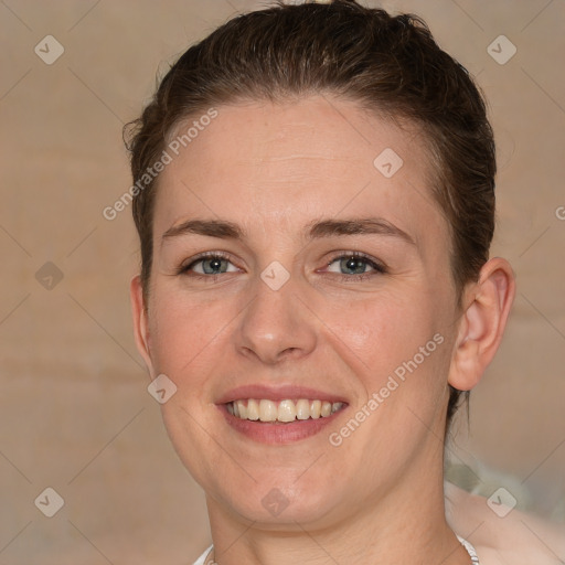 Joyful white adult female with medium  brown hair and grey eyes