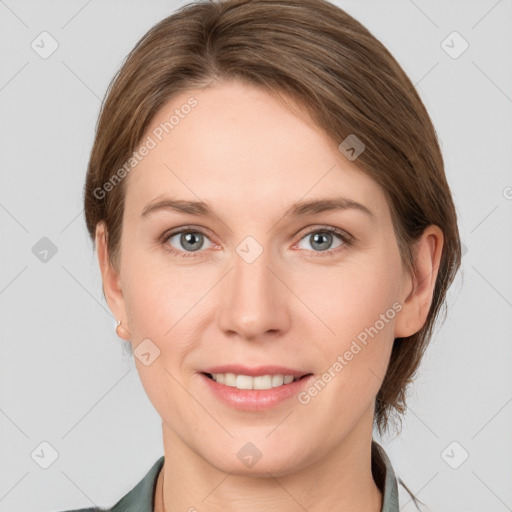 Joyful white young-adult female with medium  brown hair and grey eyes