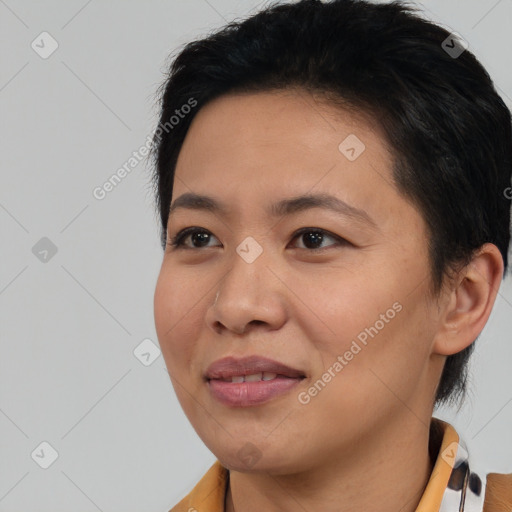 Joyful asian young-adult female with short  black hair and brown eyes