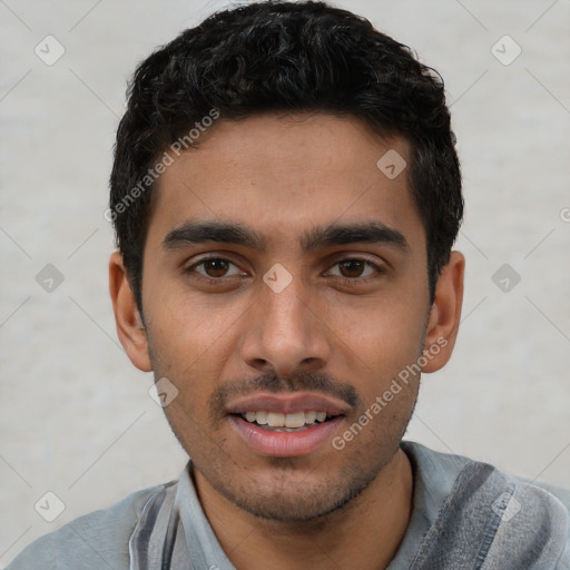 Joyful white young-adult male with short  black hair and brown eyes