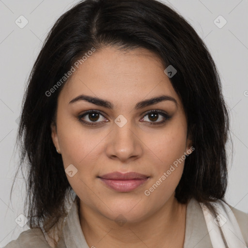 Joyful latino young-adult female with medium  brown hair and brown eyes