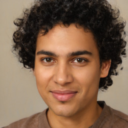 Joyful latino young-adult male with short  brown hair and brown eyes