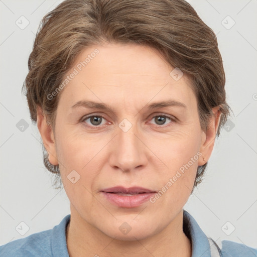 Joyful white adult female with short  brown hair and grey eyes