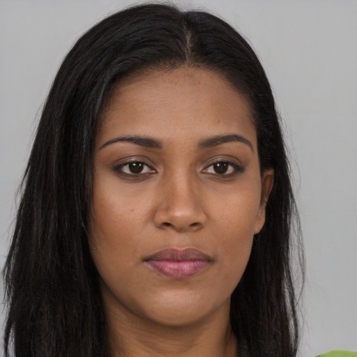 Joyful asian young-adult female with long  brown hair and brown eyes