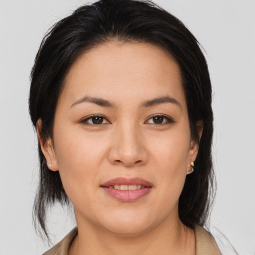 Joyful asian young-adult female with medium  brown hair and brown eyes