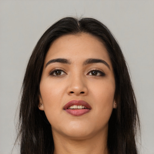 Neutral latino young-adult female with long  brown hair and brown eyes