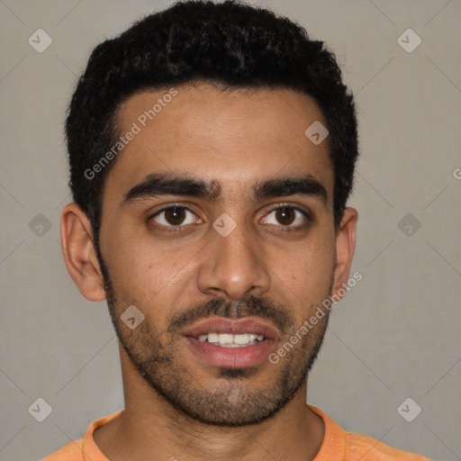 Joyful latino young-adult male with short  black hair and brown eyes