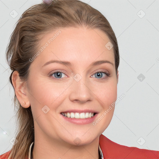 Joyful white young-adult female with long  brown hair and blue eyes