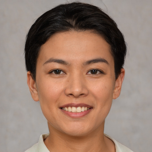 Joyful white young-adult female with short  brown hair and brown eyes
