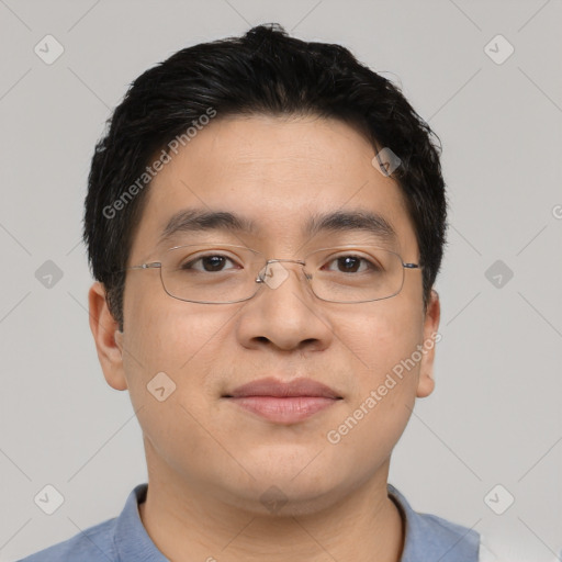 Joyful asian young-adult male with short  brown hair and brown eyes