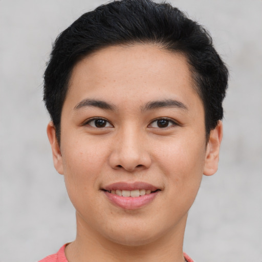 Joyful asian young-adult female with short  brown hair and brown eyes