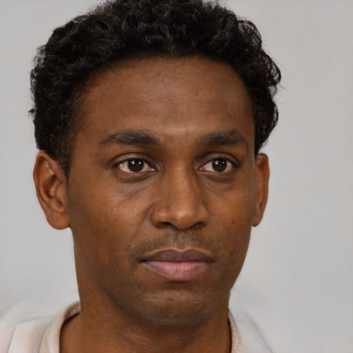 Neutral black young-adult male with short  brown hair and brown eyes