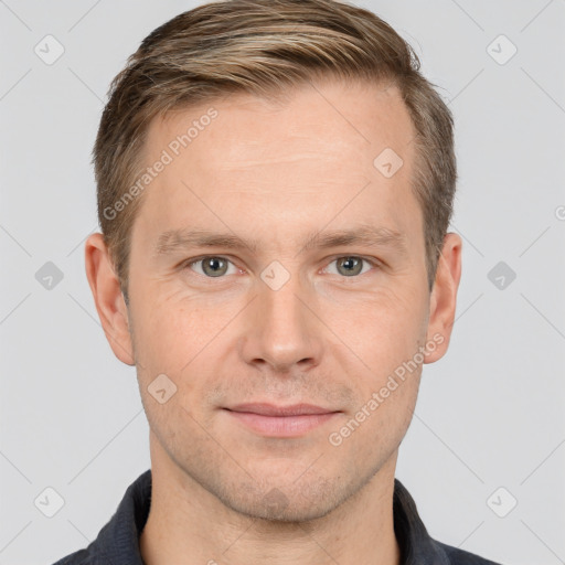 Joyful white adult male with short  brown hair and grey eyes