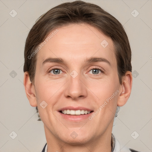 Joyful white adult male with short  brown hair and grey eyes