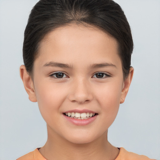 Joyful white child female with short  brown hair and brown eyes