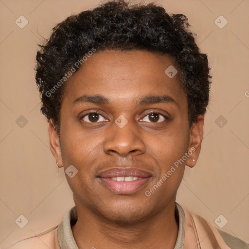 Joyful black young-adult male with short  brown hair and brown eyes