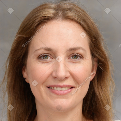 Joyful white adult female with medium  brown hair and grey eyes