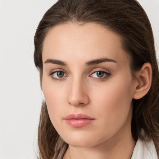 Neutral white young-adult female with long  brown hair and grey eyes