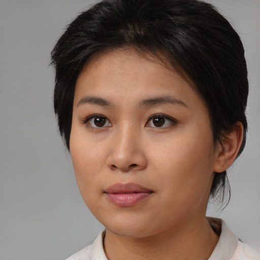 Neutral asian young-adult female with medium  brown hair and brown eyes