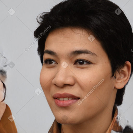 Joyful asian young-adult female with medium  black hair and brown eyes