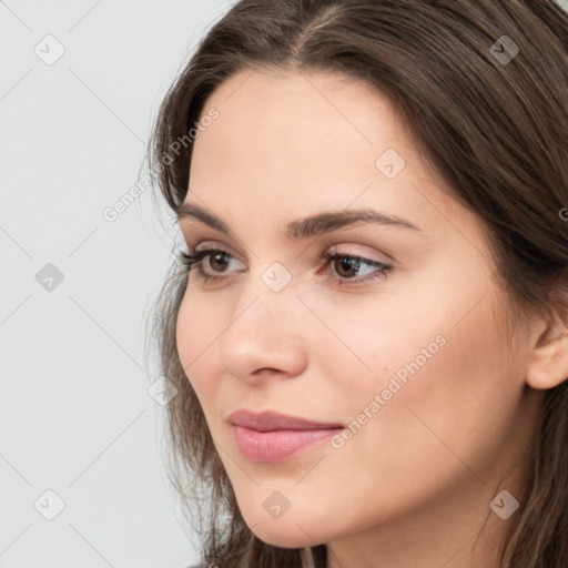 Neutral white young-adult female with medium  brown hair and brown eyes