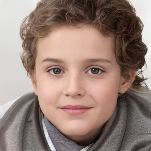 Joyful white child female with short  brown hair and grey eyes