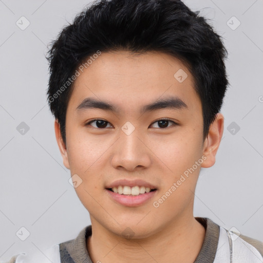 Joyful asian young-adult male with short  black hair and brown eyes