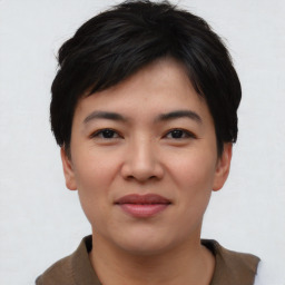 Joyful asian young-adult female with short  black hair and brown eyes