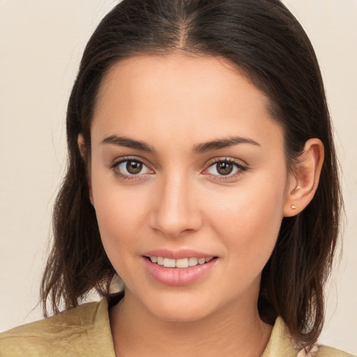 Joyful white young-adult female with medium  brown hair and brown eyes