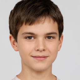 Joyful white child male with short  brown hair and brown eyes