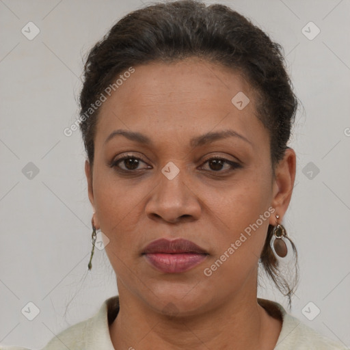 Joyful latino adult female with short  brown hair and brown eyes