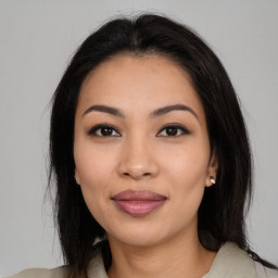 Joyful latino young-adult female with medium  brown hair and brown eyes