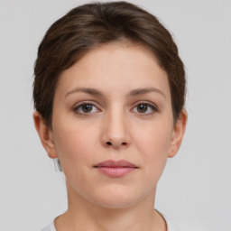 Neutral white young-adult female with short  brown hair and brown eyes