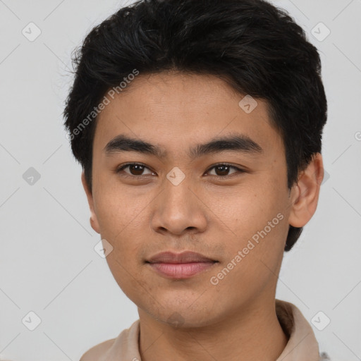 Joyful asian young-adult male with short  brown hair and brown eyes
