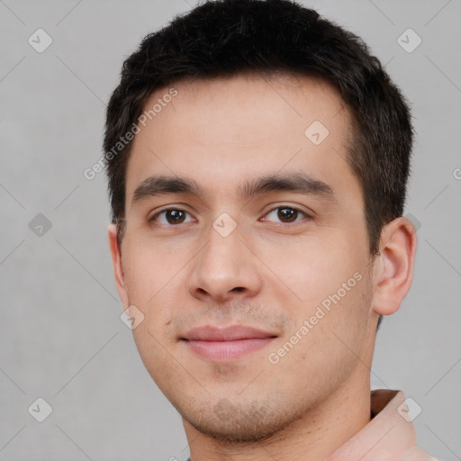 Joyful white young-adult male with short  black hair and brown eyes