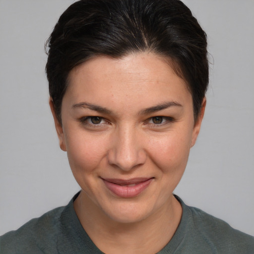 Joyful white young-adult female with short  brown hair and brown eyes