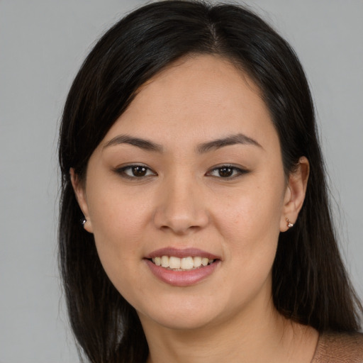 Joyful asian young-adult female with medium  brown hair and brown eyes