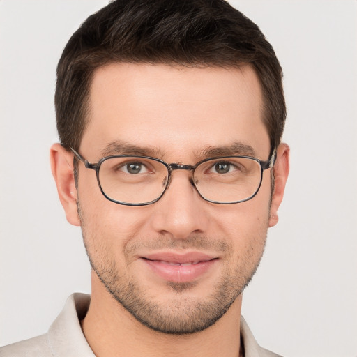 Joyful white young-adult male with short  brown hair and brown eyes